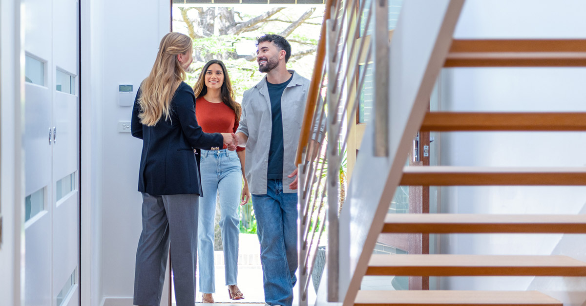 property owner showing renters a property